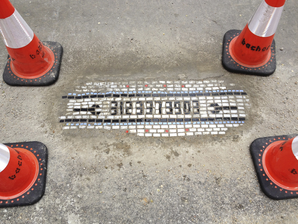 Chicago Artist Mends Potholes with Mosaics potholes mosaics Chicago