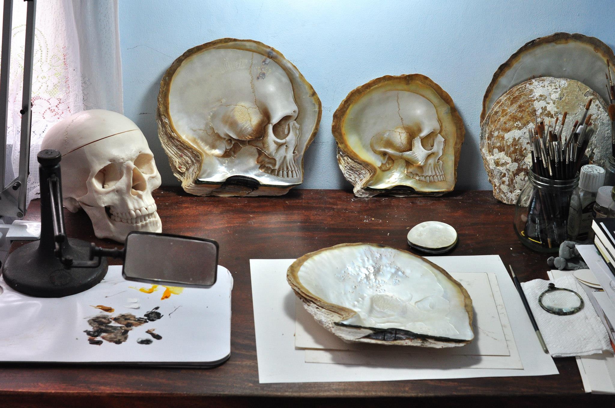 Mother of Pearl Shell Skull Carvings by Gregory Halili skulls shells bas relief anatomy